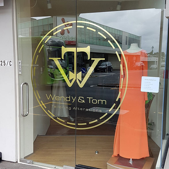 Gray Car in front of the Balmoral Drycleaners Store